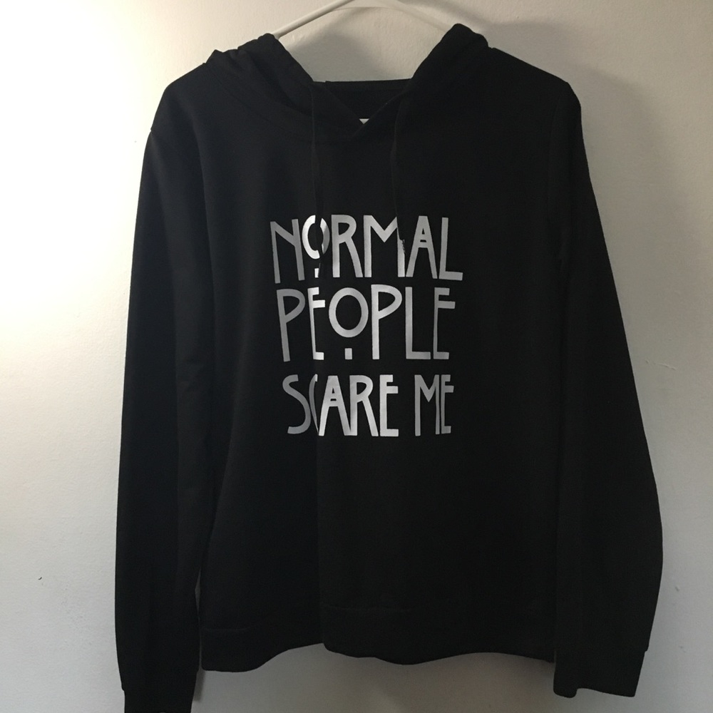 “Normal People Scare Me” print sweater